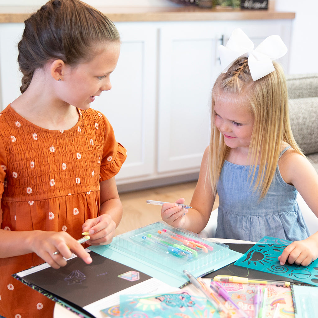Young girls play with STEAM art activity